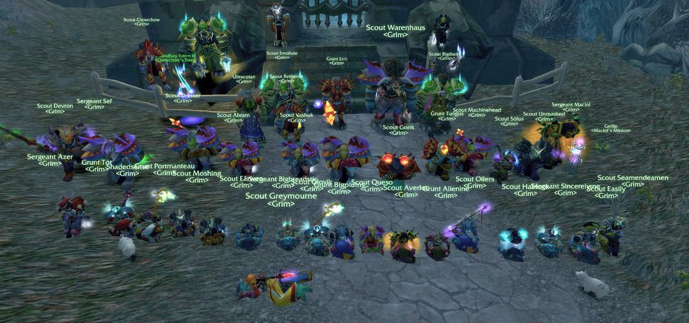 Around forty Grim members drawn up in ranks on the road outside Karazhan, almost every nameplate carrying the guild tag and a vanilla PvP rank.